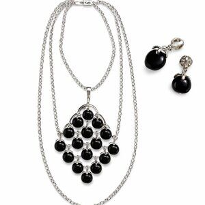 Vintage Crown Trifari black waterfall necklace with matching clip-on earrings